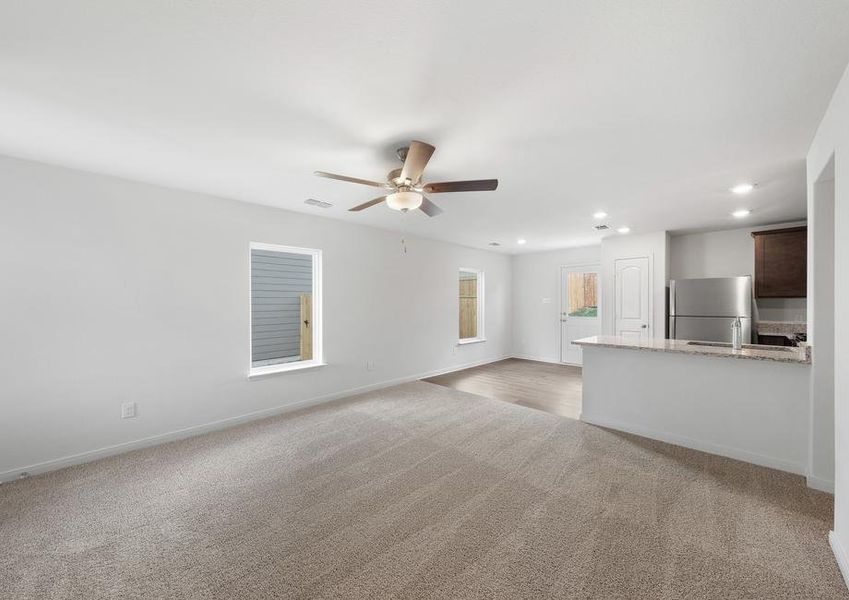 The open layout connects the family room with the kitchen and dining room.