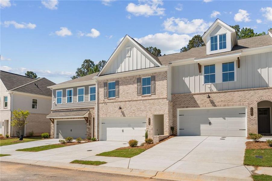 Front exterior of a new home in Wildwood Place, Powder Springs, GA, highlighting curb appeal (Image 20).