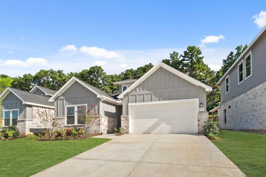 Front exterior of a new home in Westridge Cove, Conroe, TX, highlighting curb appeal (Image 23). Front exterior of a new home in Westridge Cove, Conroe, TX, highlighting curb appeal (Image 23).