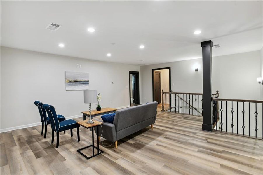 Living room featuring Luxury Vinyl Plank flooring