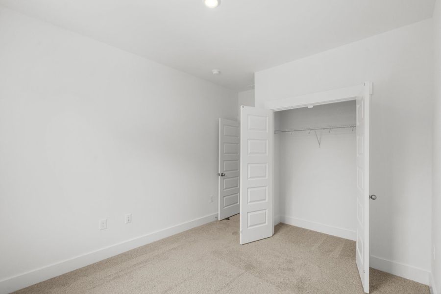 Spacious, unfurnished interior of a new home in Long Bay Golf Club, Longs (Image 36).