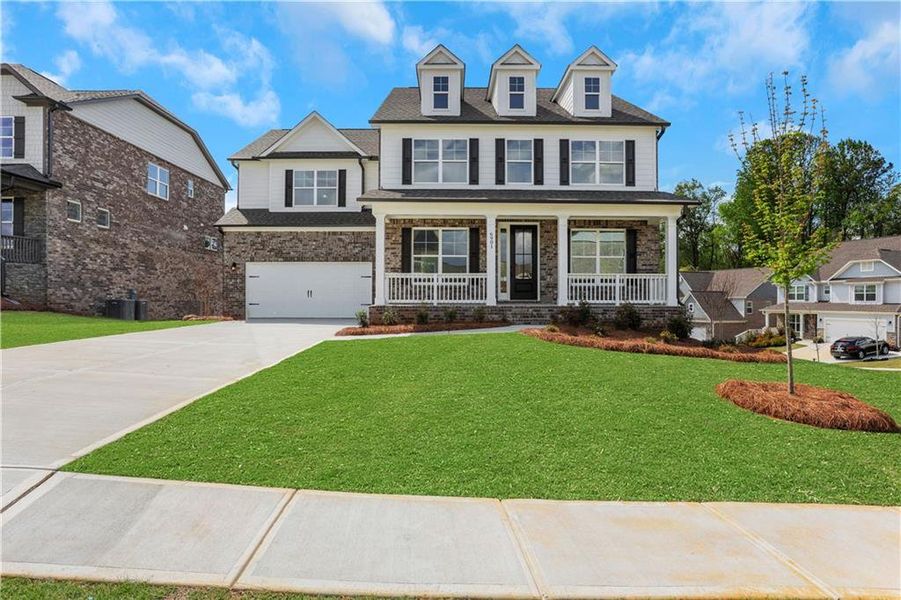 Front exterior of a new home in Cambridge, Flowery Branch, GA, highlighting curb appeal (Image 23). Front exterior of a new home in Cambridge, Flowery Branch, GA, highlighting curb appeal (Image 23).
