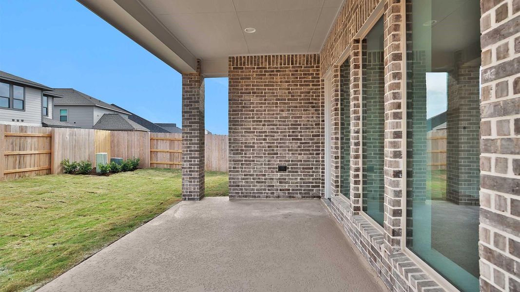 Exterior details and patio area of a home in Elyson, Cypress (Image 3).