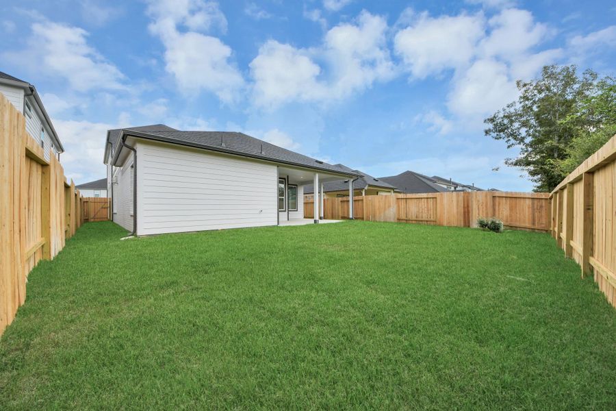 Come and see this spacious backyard with its beautiful covered patio. There is plenty of room for the kids to play and adults to relax. Perfect for your outdoor living space, patio furniture, bbq pit, and so much more. The possibilities are endless! Come and see this spacious backyard with its beautiful covered patio. There is plenty of room for the kids to play and adults to relax. Perfect for your outdoor living space, patio furniture, bbq pit, and so much more. The possibilities are endless!