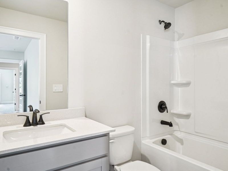 Furnished interior view inside a new home in Martin Springs - Estate Series, Lawrenceville (Image 10).