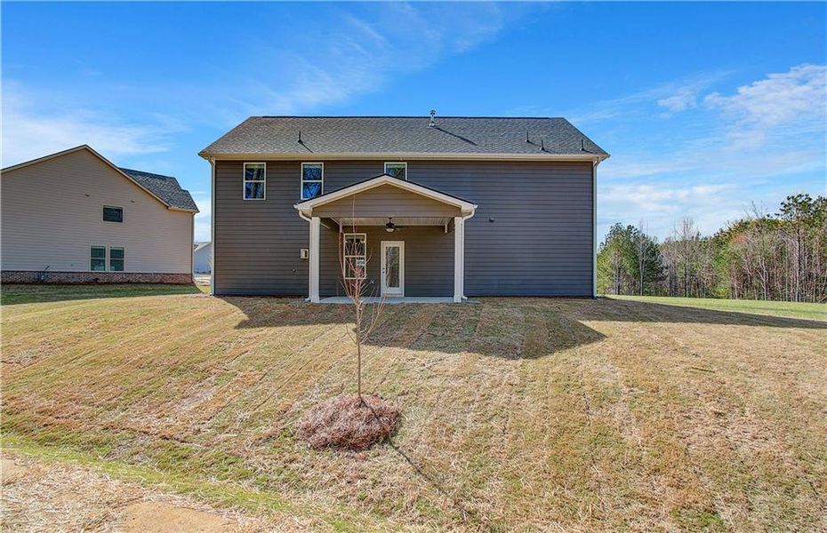 Front exterior of a new home in Copperfield, Locust Grove, GA, highlighting curb appeal (Image 17).