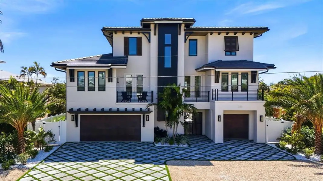 Front exterior of a new home in , Anna Maria, FL, highlighting curb appeal (Image 2).