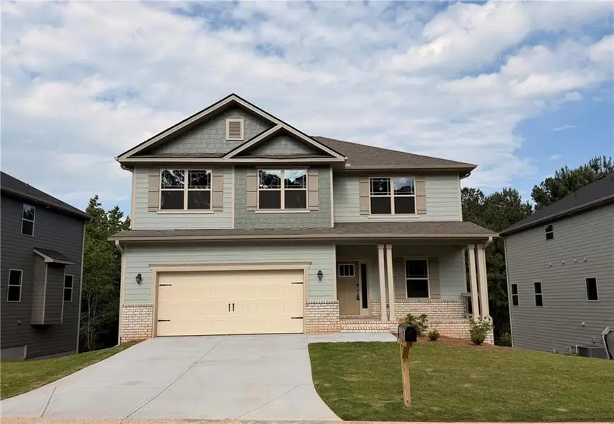 Front exterior of a new home in Magnolia Villas, Cornelia, GA, highlighting curb appeal (Image 15).