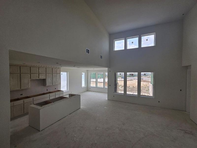 Kitchen with a towering ceiling and open floor plan Kitchen with a towering ceiling and open floor plan