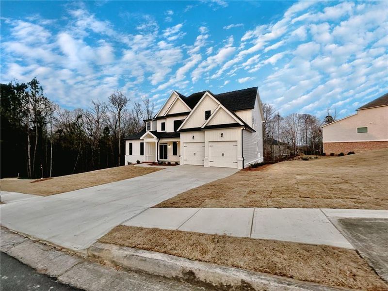 Front exterior of a new home in , Waleska, GA, highlighting curb appeal (Image 17). Front exterior of a new home in , Waleska, GA, highlighting curb appeal (Image 17).