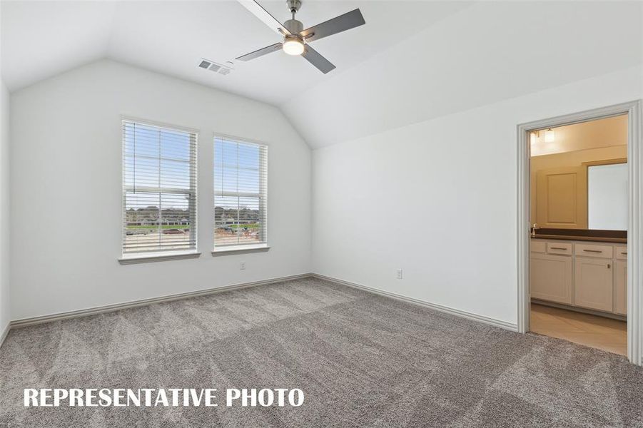 This peaceful light filled owner's bedroom is the perfect place to relax after a long day.  REPRESENTATIVE PHOTO