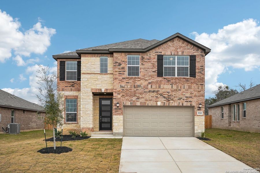 Front exterior of a new home in Carmel Ranch, Schertz, TX, highlighting curb appeal (Image 2).