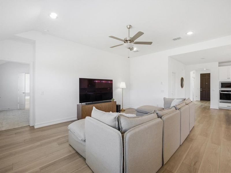 Living room view of single story three bedroom home with an office and a formal dining room