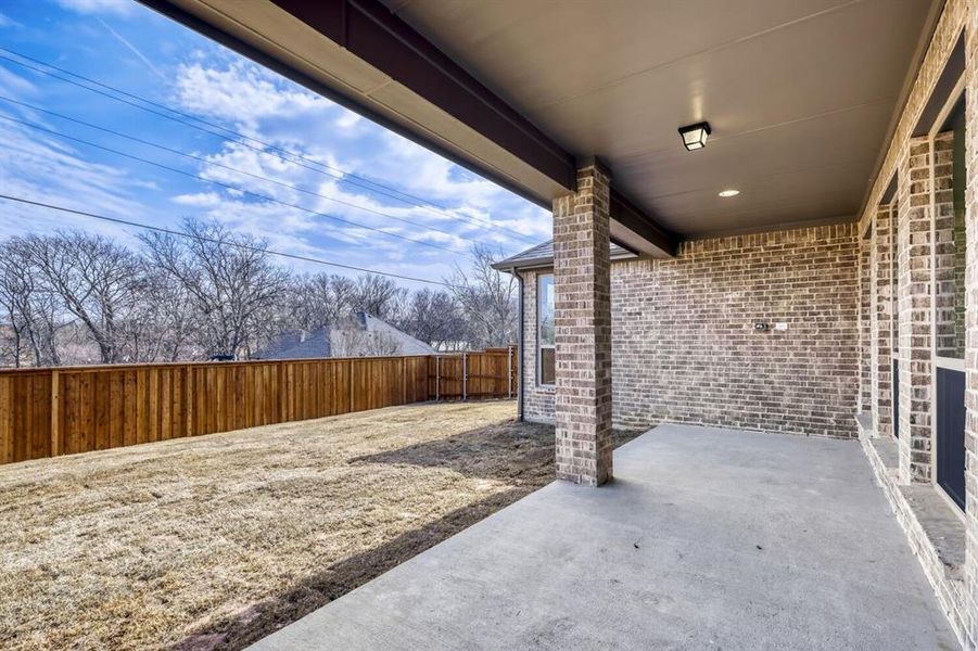 Fenced backyard featuring a patio area
