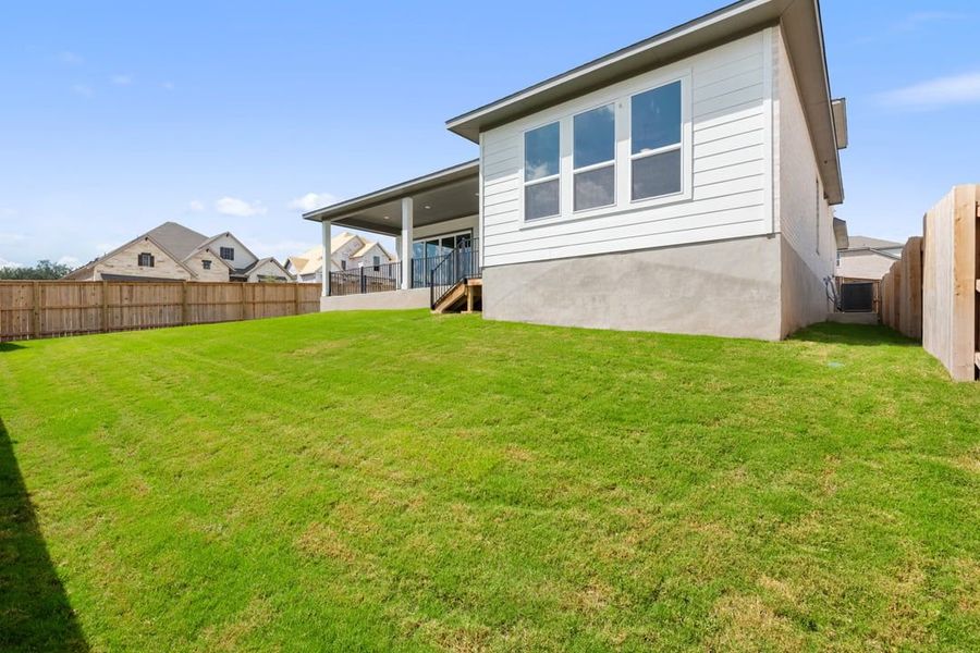 Exterior details and patio area of a home in Capitol Collection at Lariat, Liberty Hill (Image 23).