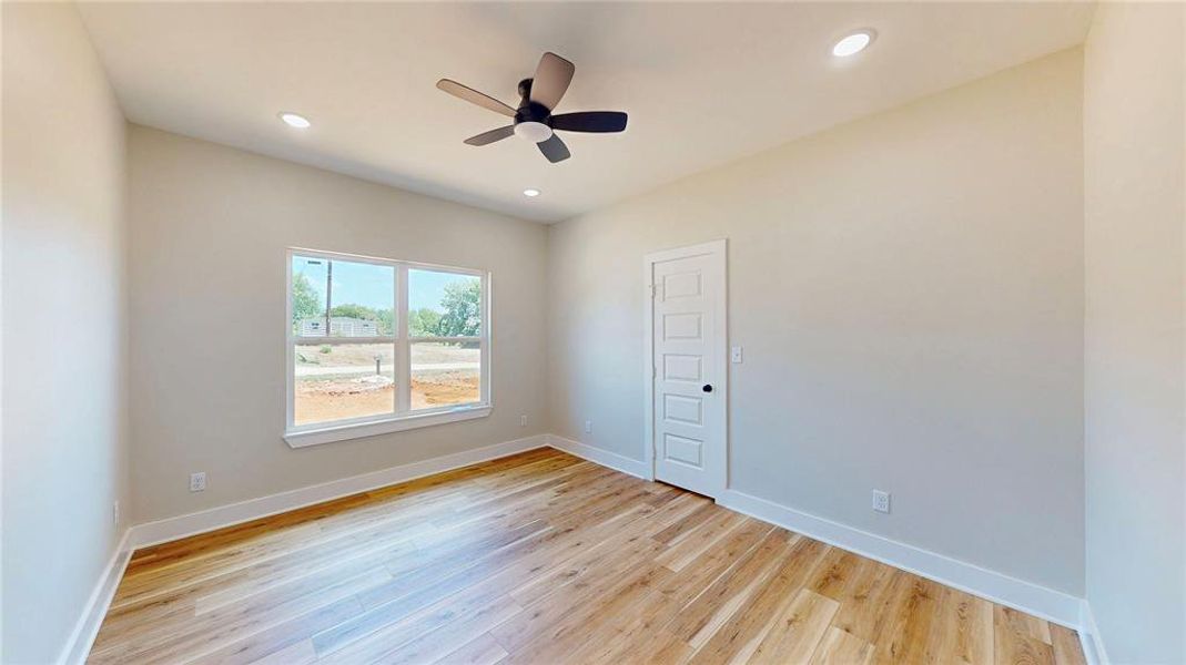 Spare room with light wood-style flooring, a ceiling fan, and recessed lighting Spare room with light wood-style flooring, a ceiling fan, and recessed lighting