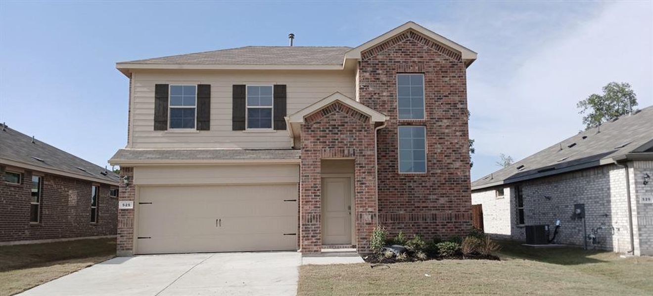 Front exterior of a new home in The Canyons, Keene, TX, highlighting curb appeal (Image 1).
