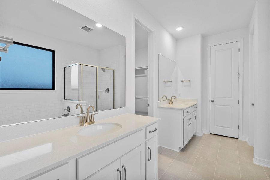 The primary bath delivers traditional refinement with classic details you'd expect in our AW Timeless Collection, with double vanities and satin nickel finishes..