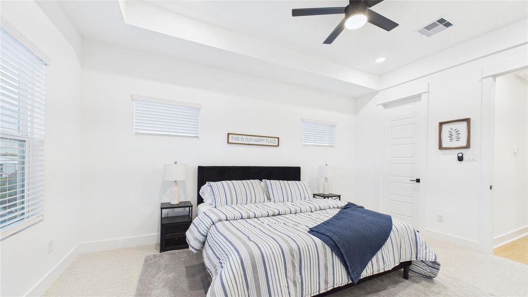 This spacious primary bedroom offers a serene retreat with ample natural light and a well-designed layout. Featuring generous proportions, elegant finishes, and a comfortable atmosphere, it provides a private oasis within the home. Its elevated position enhances privacy while creating a quiet, peaceful ambiance—ideal for relaxation This spacious primary bedroom offers a serene retreat with ample natural light and a well-designed layout. Featuring generous proportions, elegant finishes, and a comfortable atmosphere, it provides a private oasis within the home. Its elevated position enhances privacy while creating a quiet, peaceful ambiance—ideal for relaxation