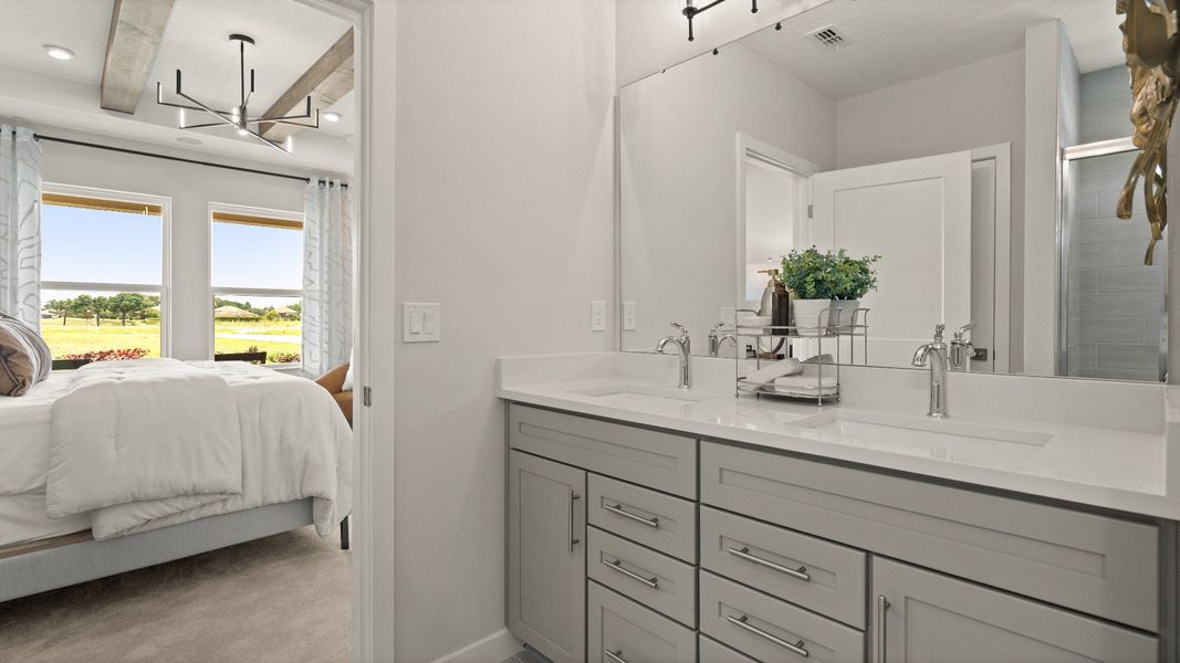 Contemporary Primary En Suite Bath with in this New Construction Home in Winter Haven by DRB Homes in Willowbrook North