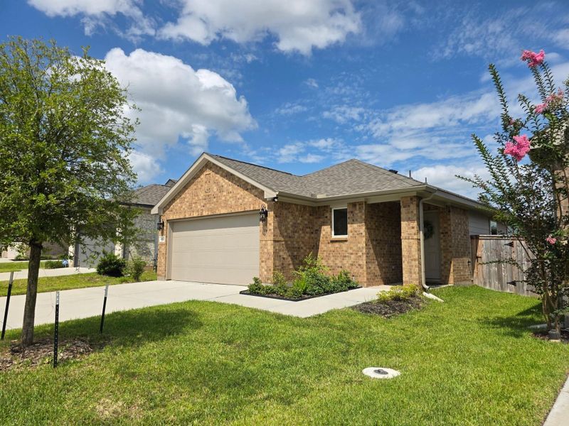 Front exterior of a new home in Montgomery Oaks - Premier, Conroe, TX, highlighting curb appeal (Image 19).