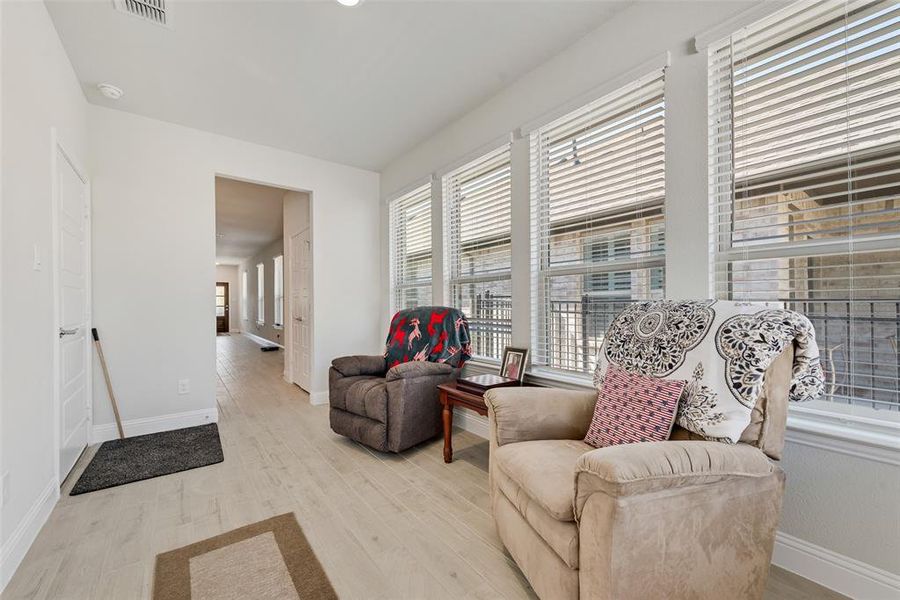 Flex room with light wood finished floors and baseboards and lots of windows! Flex room with light wood finished floors and baseboards and lots of windows!