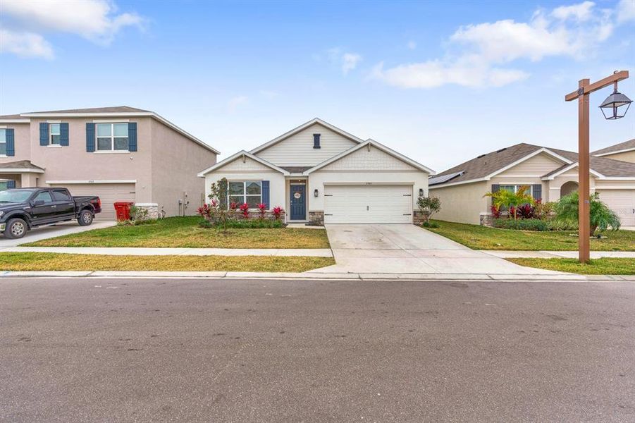 Front exterior of a new home in Farm at Varrea, Plant City, FL, highlighting curb appeal (Image 27). Front exterior of a new home in Farm at Varrea, Plant City, FL, highlighting curb appeal (Image 27).