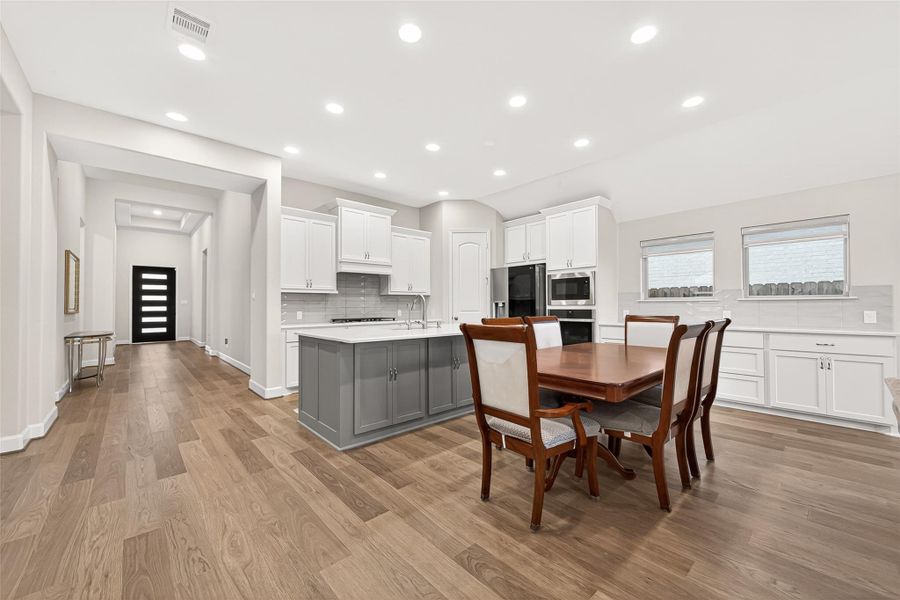 Open kitchen and dining area designed for seamless entertaining and everyday living Open kitchen and dining area designed for seamless entertaining and everyday living
