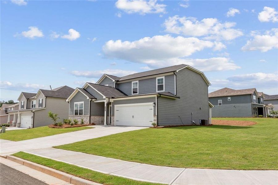 Front exterior of a new home in Reserve at Gum Springs, Jefferson, GA, highlighting curb appeal (Image 2). Front exterior of a new home in Reserve at Gum Springs, Jefferson, GA, highlighting curb appeal (Image 2).