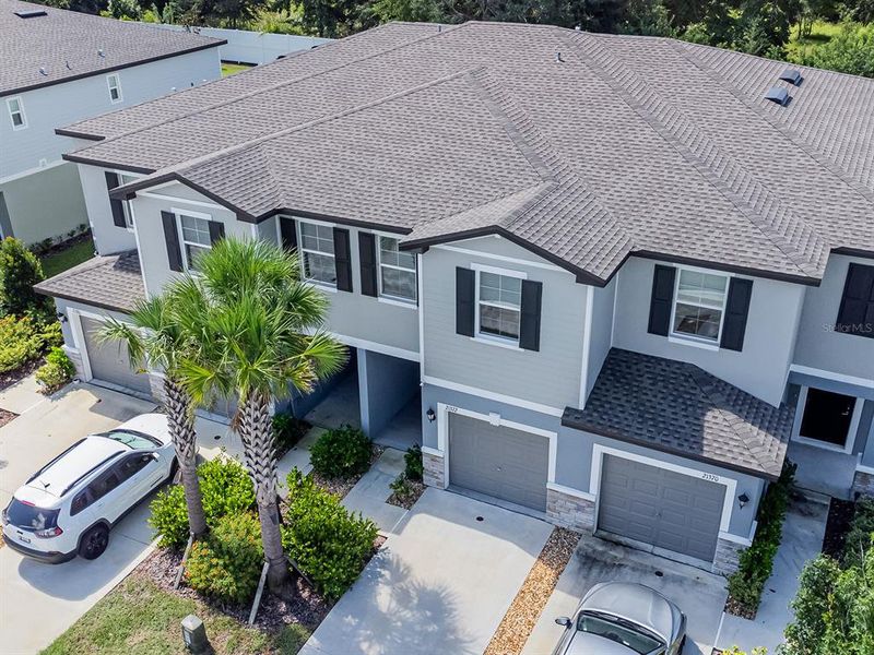 Front exterior of a new home in , Land O' Lakes, FL, highlighting curb appeal (Image 18).