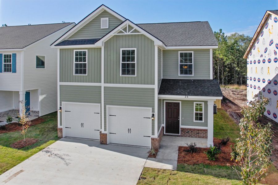 Representative exterior photo of a completed home built from the The Ryon by RTS Homes in Grand Reserve, Hinesville, GA (Image 19).