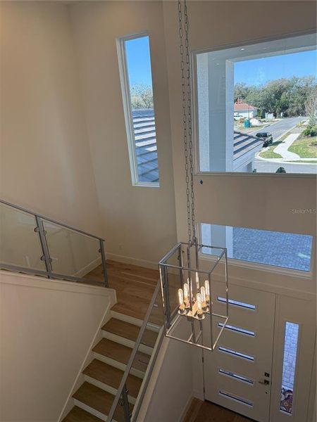 Stairwell, wood floors with Glass railings