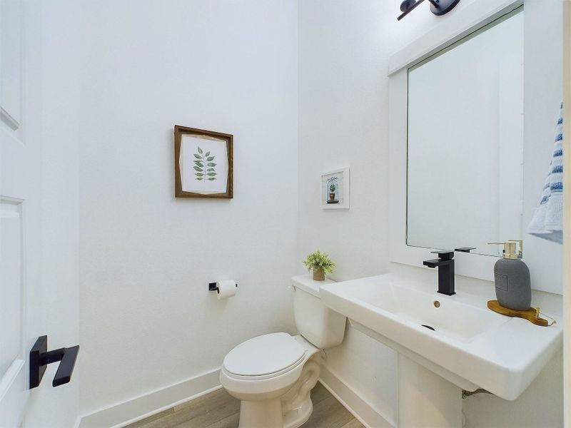The powder room is conveniently located on the first floor. Model home photos and 3D tour - FINISHES & FLOOR PLANS WILL VARY! The powder room is conveniently located on the first floor. Model home photos and 3D tour - FINISHES & FLOOR PLANS WILL VARY!