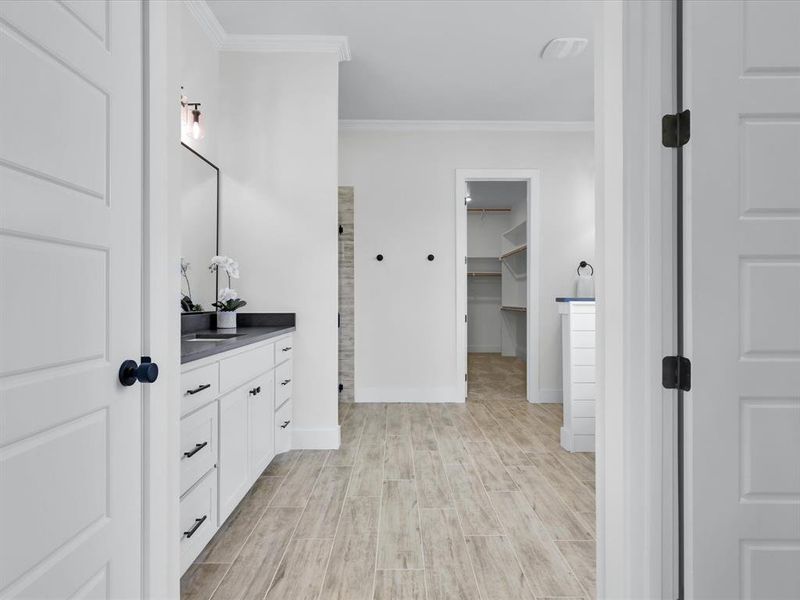 Primary bath with dual vanities, soaking tub, separate shower and ship lap.