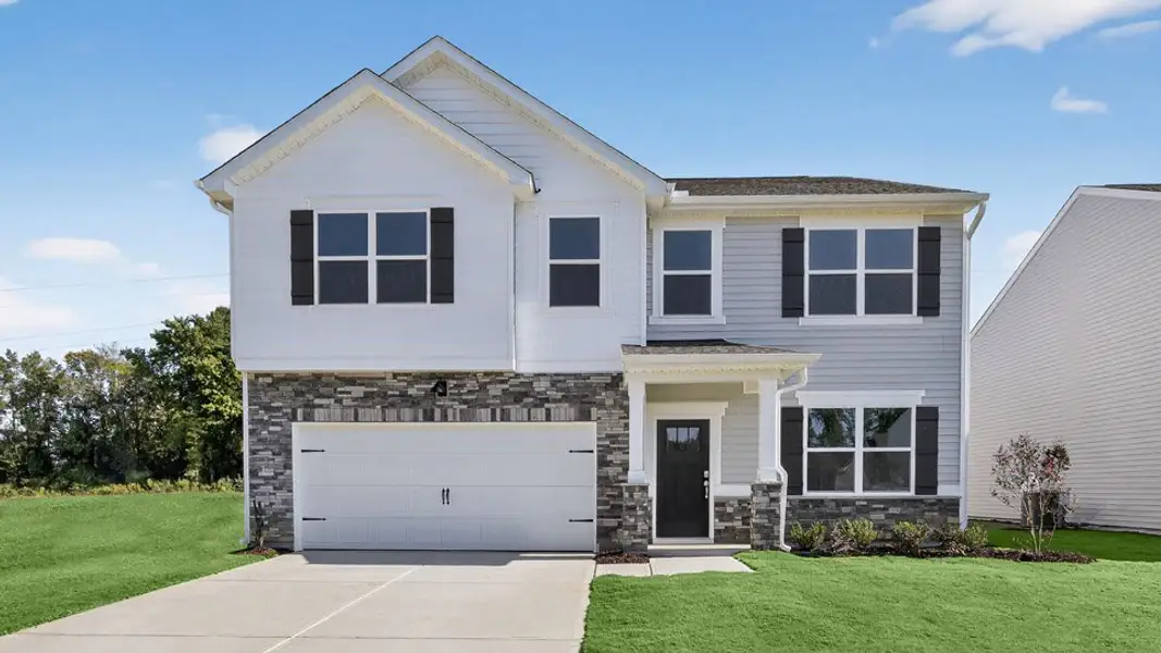 Front exterior of a new home in The Reserve at Prestleigh, Wake Forest, NC, highlighting curb appeal (Image 1). Front exterior of a new home in The Reserve at Prestleigh, Wake Forest, NC, highlighting curb appeal (Image 1).