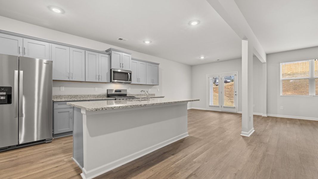 Representative furnished interior of a home built from the Halton by D.R. Horton in Highland Hills, Graniteville (Image 5).