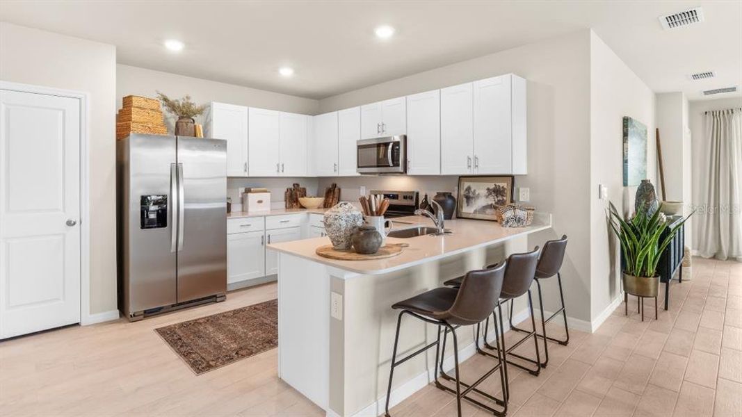 Furnished interior view inside a new home in Central Parc, North Port (Image 4).