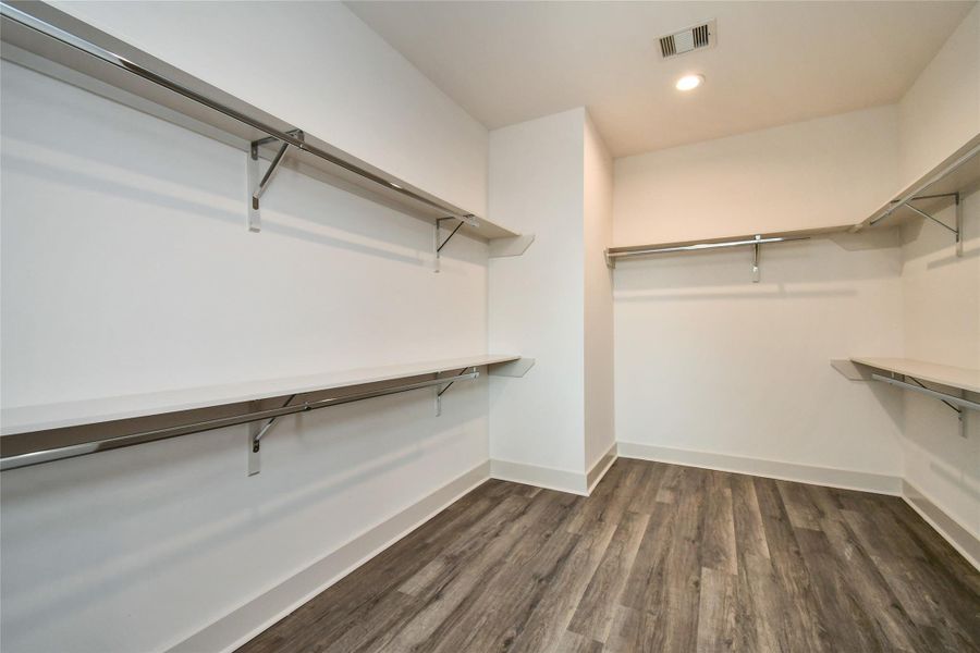 Primary Bedroom Walk-in Closet Primary Bedroom Walk-in Closet