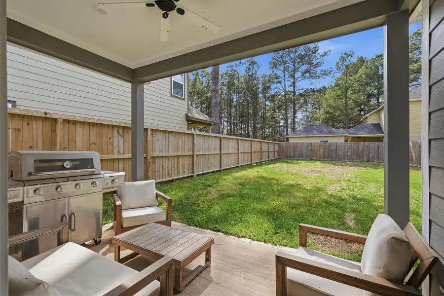 Exterior details and patio area of a home in , Conroe (Image 3).