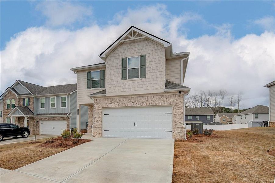 Front exterior of a new home in Westminster, Covington, GA, highlighting curb appeal (Image 16).
