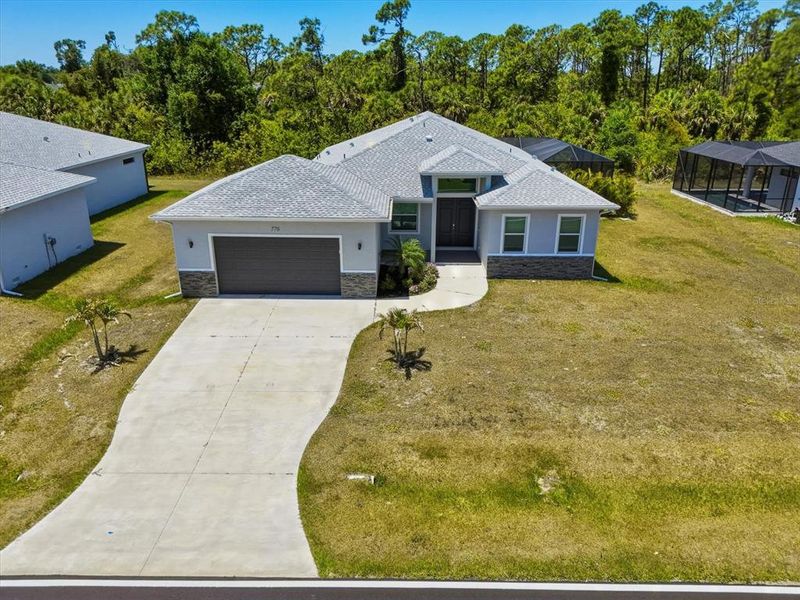 Front exterior of a new home in , Rotonda West, FL, highlighting curb appeal (Image 1). Front exterior of a new home in , Rotonda West, FL, highlighting curb appeal (Image 1).