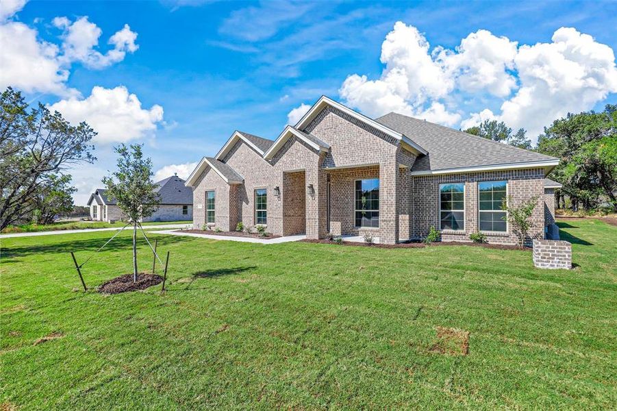 View of front of property with a front yard