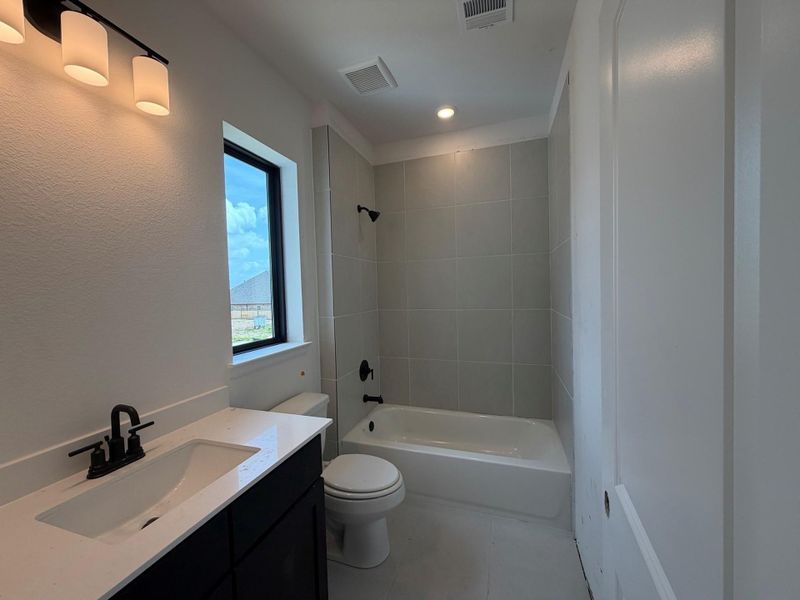 Furnished interior view inside a new home in Meridiana 70', Manvel (Image 6).