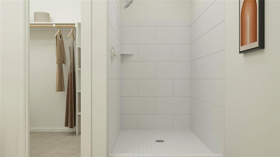 Bathroom featuring tiled shower