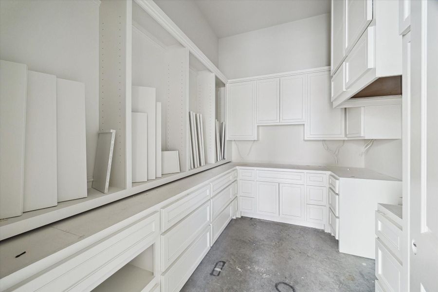 Progress photo from December 2025 - Prep kitchen and pantry adjacent to main kitchen will feature a stainless steel cooking range and space for a secondary full-size refrigerator.