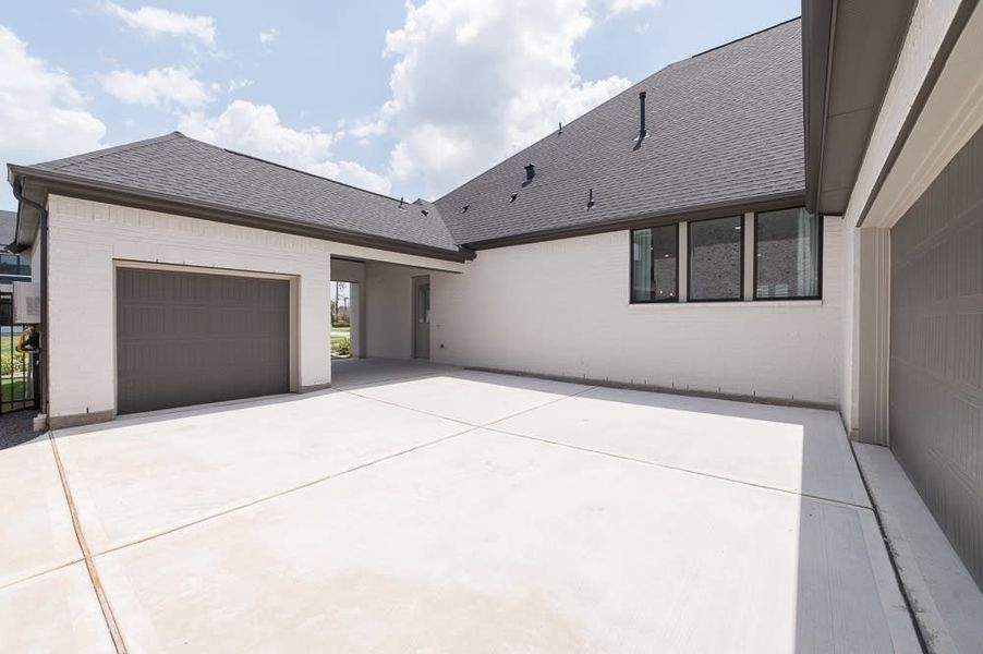 Exterior details and patio area of a home in Woodson’s Reserve, Spring (Image 19).