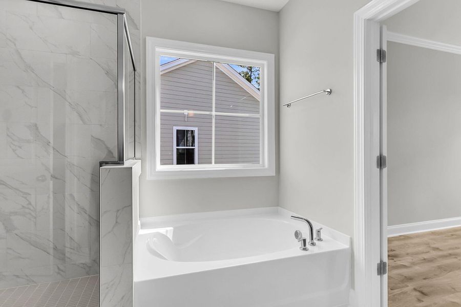 Furnished interior view inside a new home in Tidewater at Lakes of Cane Bay, Summerville (Image 14).