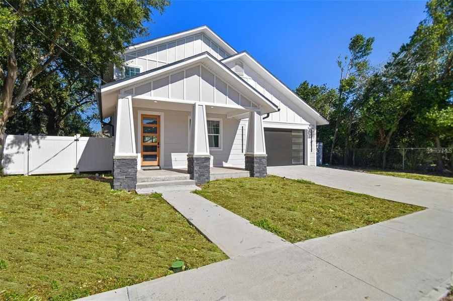 Front exterior of a new home in , Tampa, FL, highlighting curb appeal (Image 16).