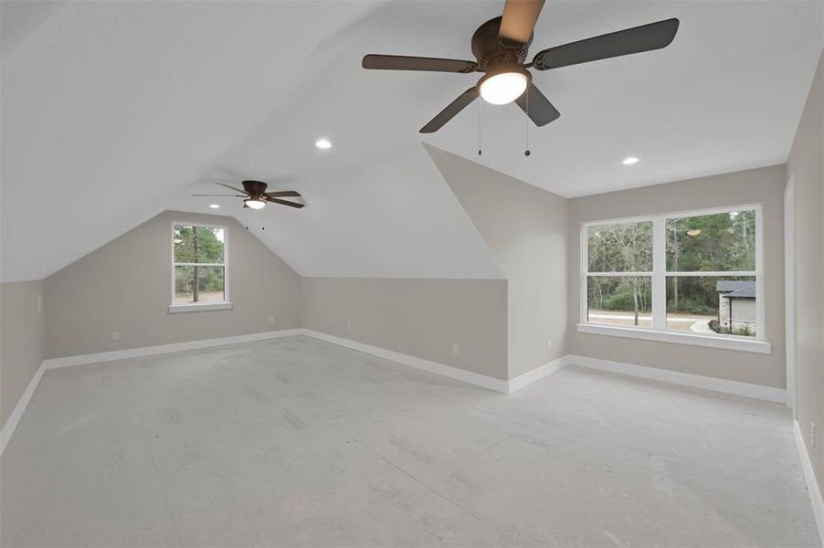 The game room, above the garage, has 2 closets and attic access.