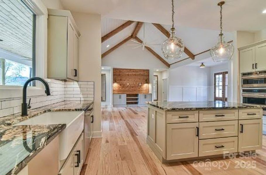 Fabulous kitchen open to great room. Similar photo.